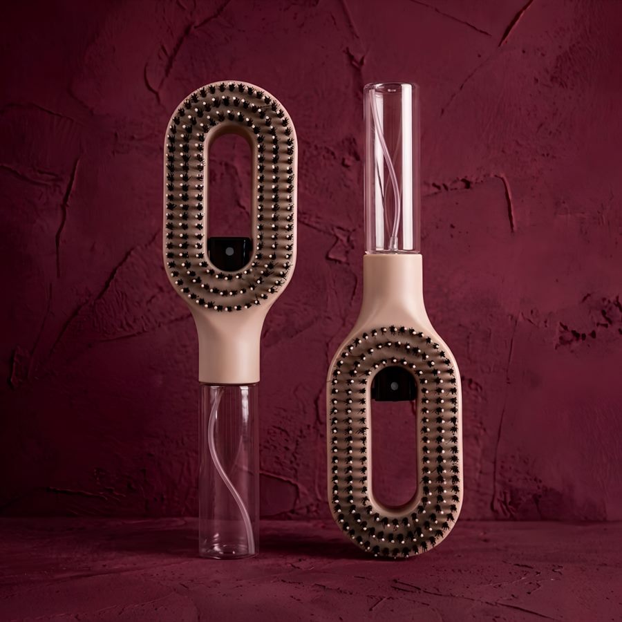 Two 2-in-1 Hair Mist Brushes standing upright against a deep burgundy backdrop